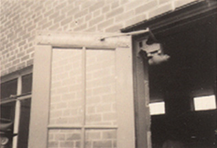 Reinforcement at head of exterior door to prevent splitting by windstorm
