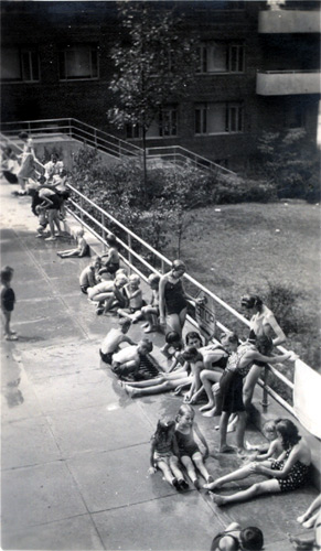 View from top of concrete platform in front of 346 Dudley Street, with camera focused on shower heads, July 1940