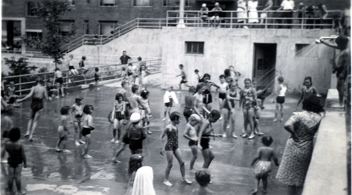View from top of wall against corner of Building Number 8, looking down on shower platform, July 1940