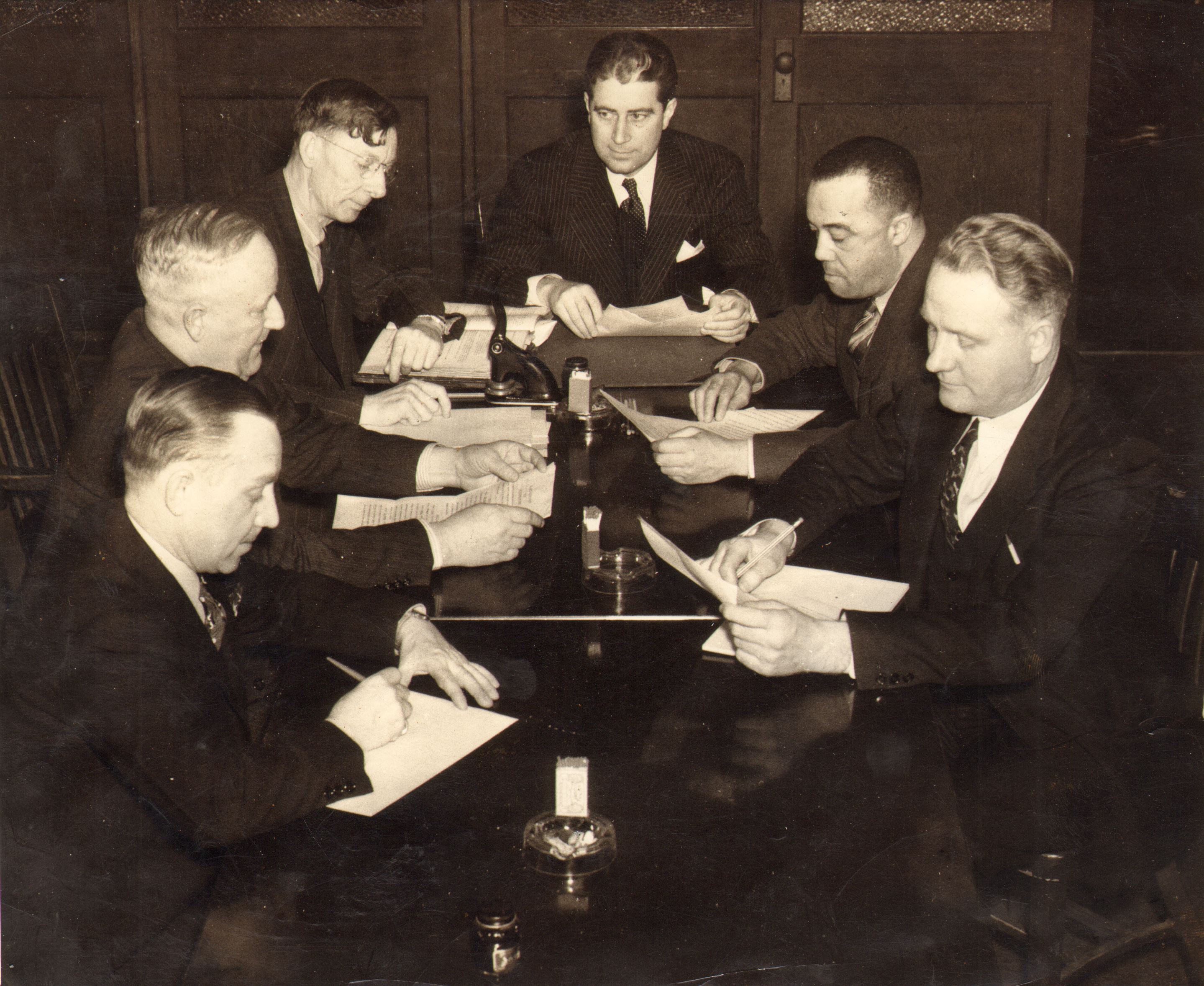 Housing Authority members meeting in the 1940s — from left: Unknown, Wilbert F. Dobbins, Horace Dixon, Bartholomew Sheehan, Dr. Howard E. Primas Sr., Unknown