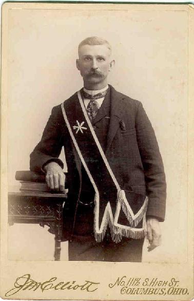 Early Red Men member wearing sash, badge, and ceremonial pouches