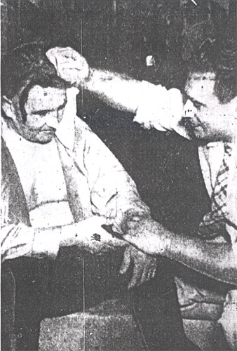 Audubon Police Sergeant Augustus F. 'Dewey' Parker treated for heat prostration at the Hollingshead fire, July 30, 1940 — Courier-Post, July 31, 1940