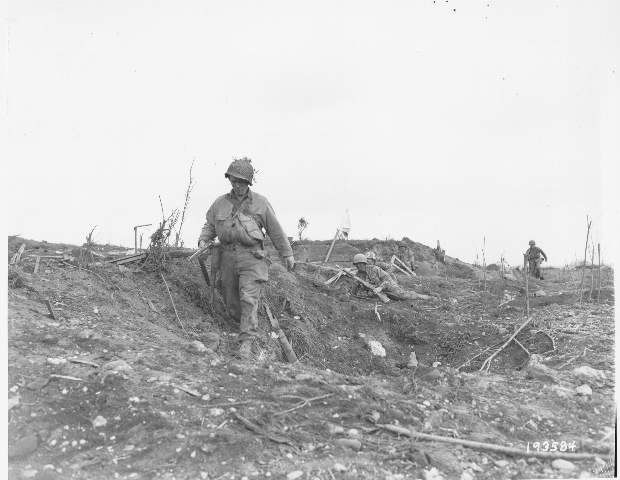 The remnants of Company I, 23rd Infantry Regiment, 2nd Infantry Division, advance through area near Brest, France, 29 August 1944