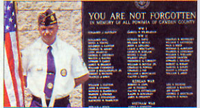 Tim Weiser of Magnolia, a member of American Legion Post 370, stands next to the POW/MIA memorial in Lindenwold