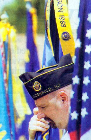 James Carey of Lindenwold, a member of American Legion Post 56, bows his head during the dedication ceremony for Camden County's POW/MIA memorial