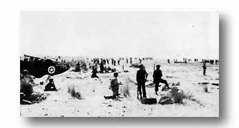 In mid-morning Italian sunshine, naval beach officers speed unloading and troop movement at Salerno