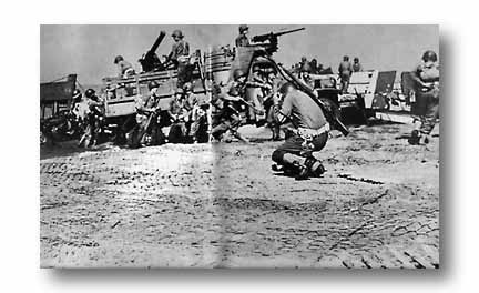36th Division troops disembark on-the-double at Salerno; enemy artillery fire has been heavy