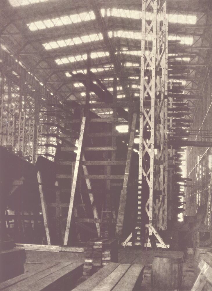 Under the lofty roof of the covered ways where the largest naval and merchant ships are built, New York Shipbuilding Corporation, 1921