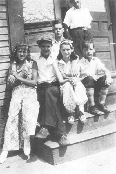 Flanagan family on Locust Street, 1930s: Front L to R: Hazel Flanagan, unknown, Jessie Flanagan, George Flanagan; Rear: Lester Flanagan; Standing: unknown