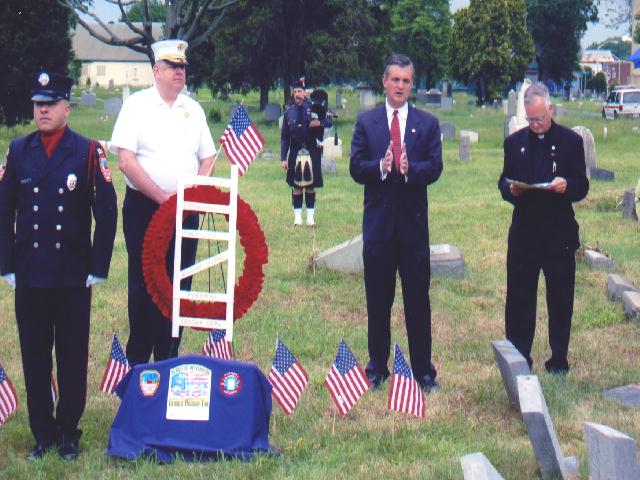 US Congressman Robert Andrews speaking at the dedication of the new headstone for Camden Fireman William Hillman