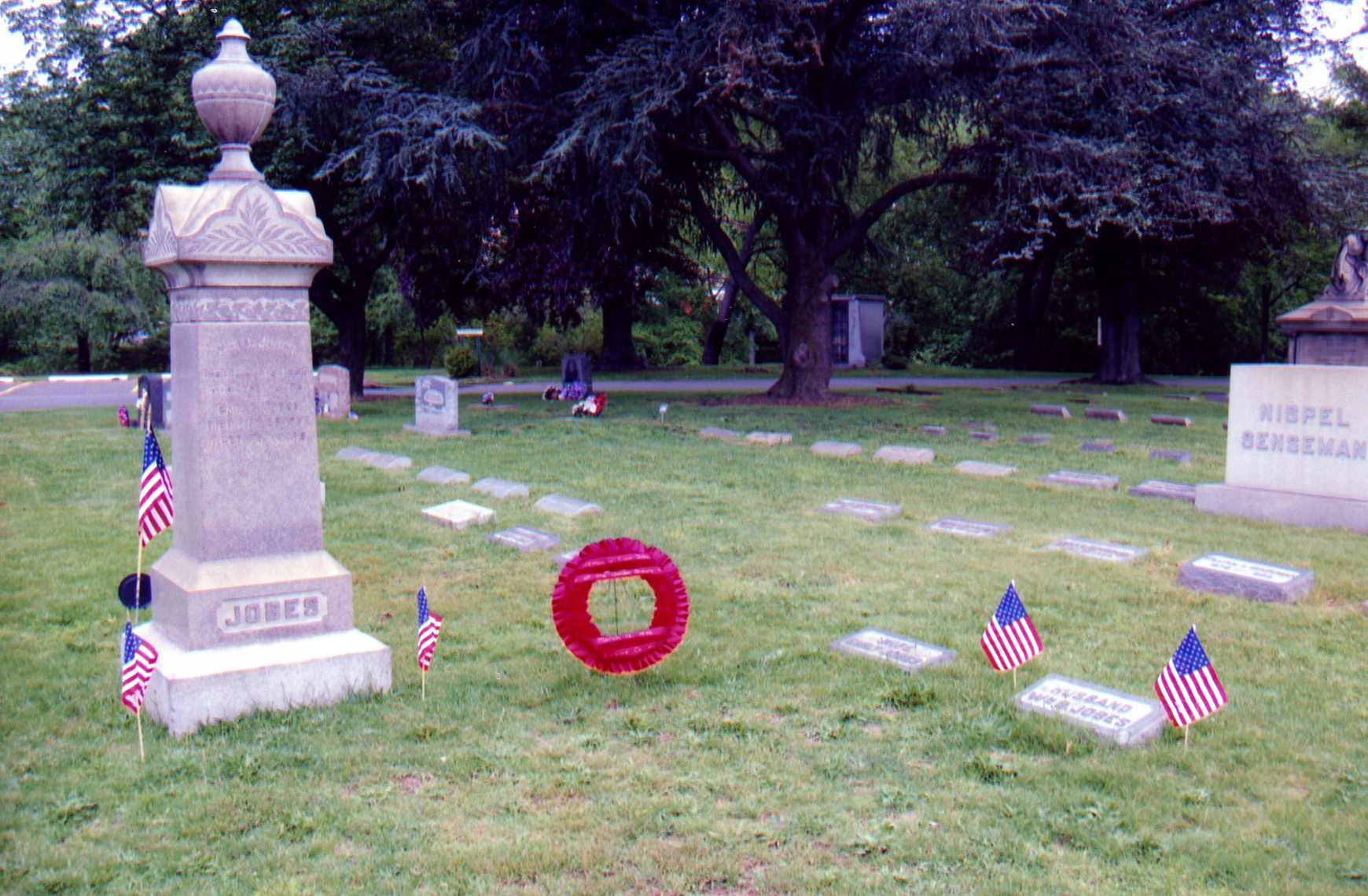 Flags and wreath at the grave site of Fireman William Jobes