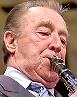 Portrait of Buddy DeFranco with clarinet, photo by Denny Lester