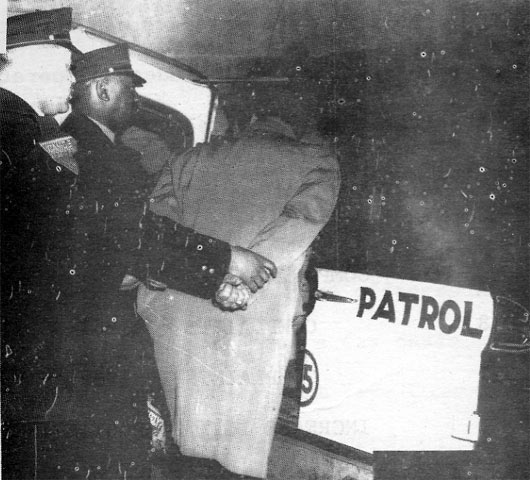 Officer Robert A. Upshaw Sr. (at left) with Officer Clyde Waters making an arrest, 1962