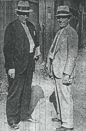 Detective Lieutenant George A. Ward and Detective Sergeant Gus Koerner at rear of 243 Sycamore Street