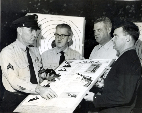 Sgt. William Schultz (left) and Andrew McBurney — firearms instruction, 1950s