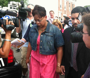 Mayor Dana L. Redd leaving a news briefing Friday at the fire scene