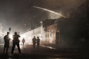 Firefighters battle a fire at 6th Street and Carl Miller Boulevard in Camden