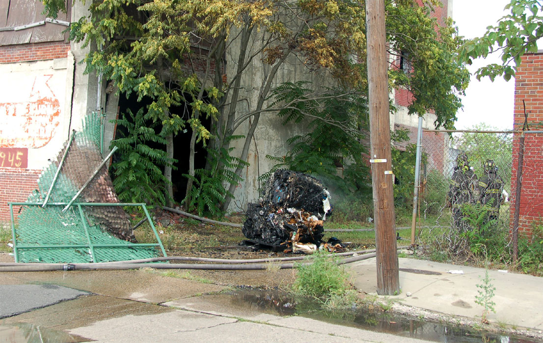 Units breaking through fence to reach fire