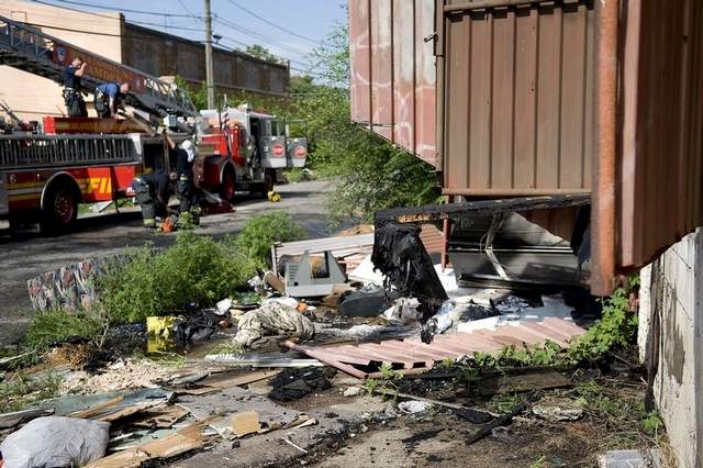 Aftermath of fire at 6th and Liberty Streets. Firefighters pack up after a three-alarm blaze.