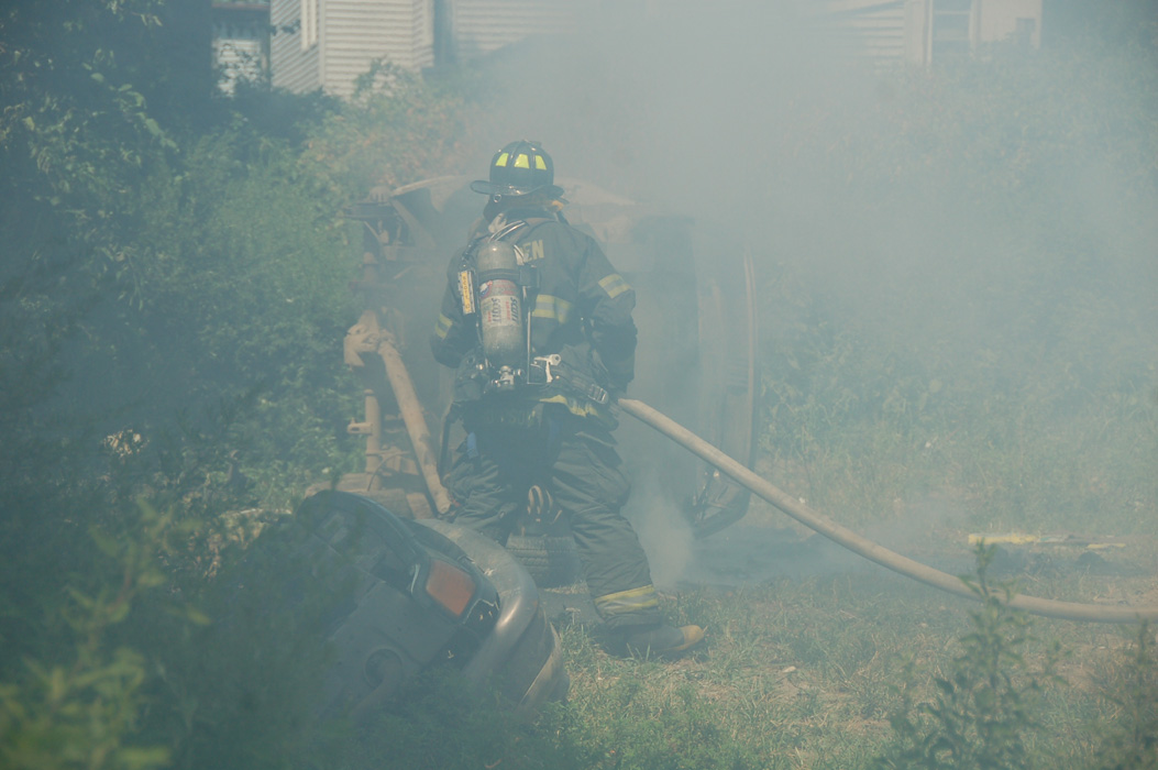 Frank Thompson goes into the smoke to put out the hot spots (original)