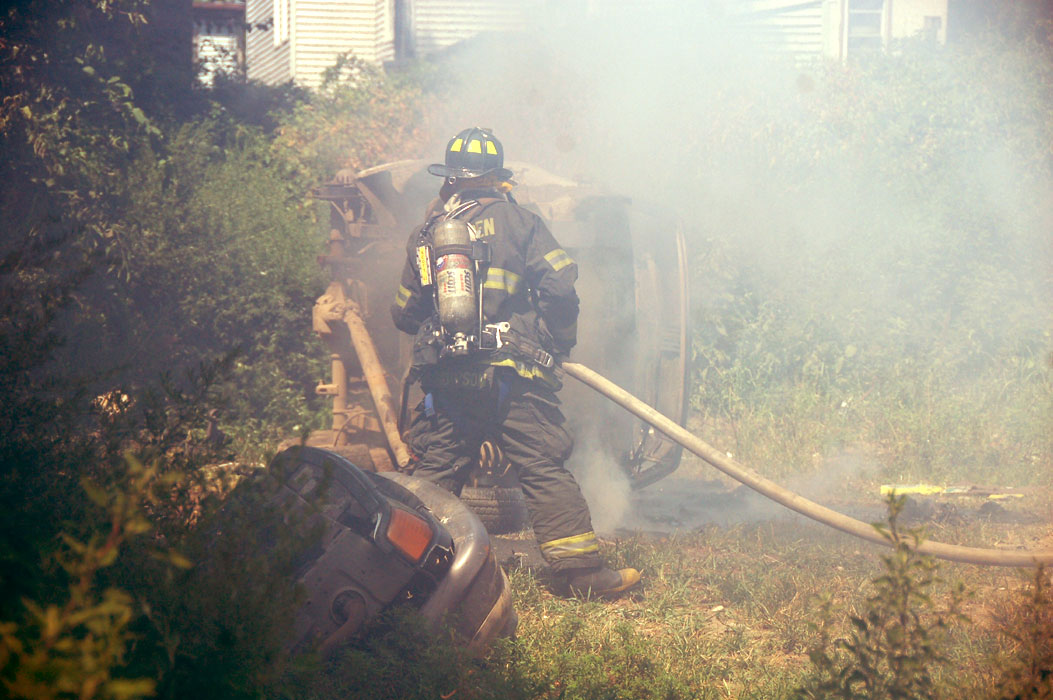 Frank Thompson goes into the smoke to put out the hot spots (color-adjusted)