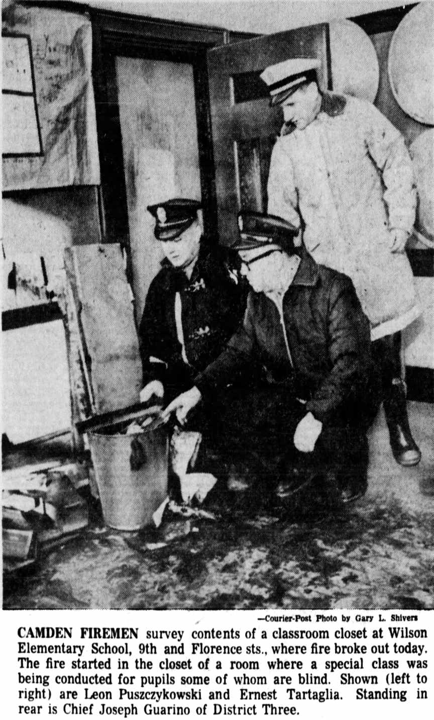 Camden firemen survey a classroom closet at Wilson Elementary School, 9th and Florence streets, where fire broke out. Shown left to right are Leon Puszczykowski and Ernest Tartaglia. Standing in rear is Chief Joseph Guarino of District Three.