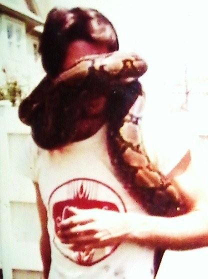Joe Seddon with a 13-foot Reticulated python named Steamhorse