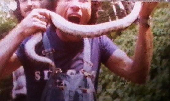 Joe Seddon taking a bite out of a rattler