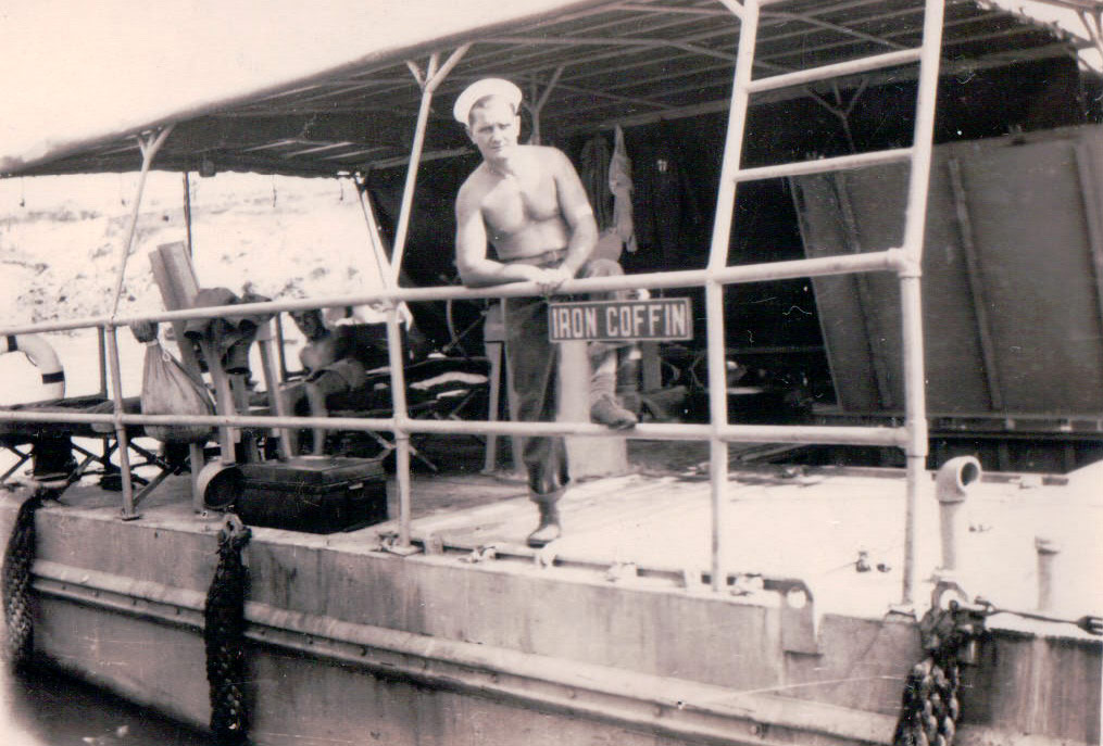 James J. Cusick Sr. on the deck of the 'Iron Coffin' river patrol craft, India, World War II