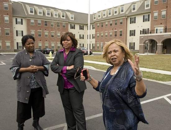 Camden Mayor Dana Redd (center) and Novella Hinson (right) talk with property manager Ronda High while visiting Antioch Manor and John O. Parker Hall in Camden