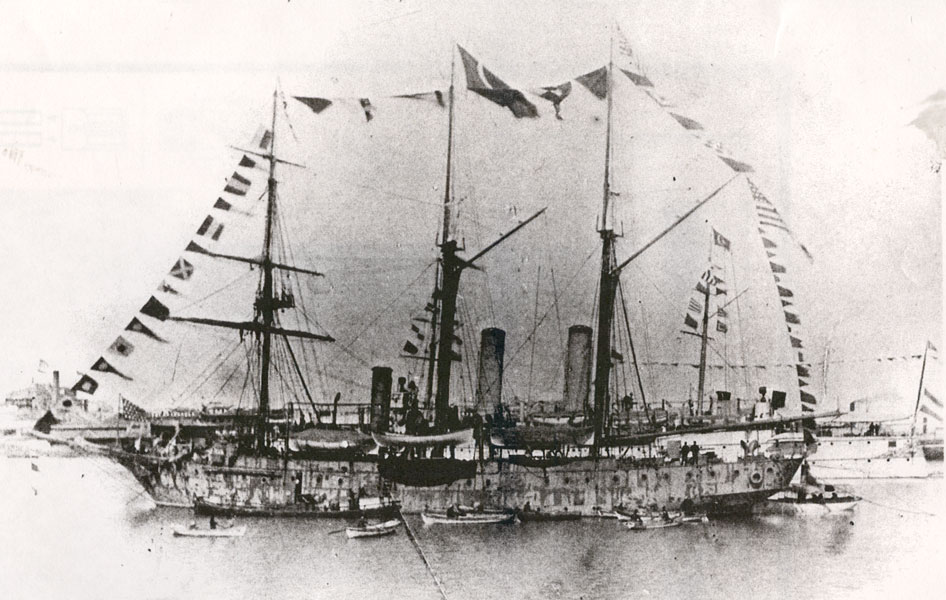 USS Princeton in harbor at Suez, Egypt, circa February 13, 1899, dressed with flags