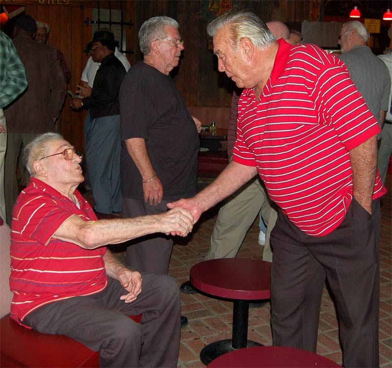 John DiMaggio shaking hands with William Wilkie, with Richard Brooks standing behind them, Camden Firefighters Reunion 2010