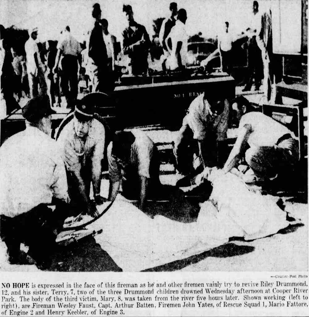 Firemen try to revive Drummond children at Cooper River Park, August 1954