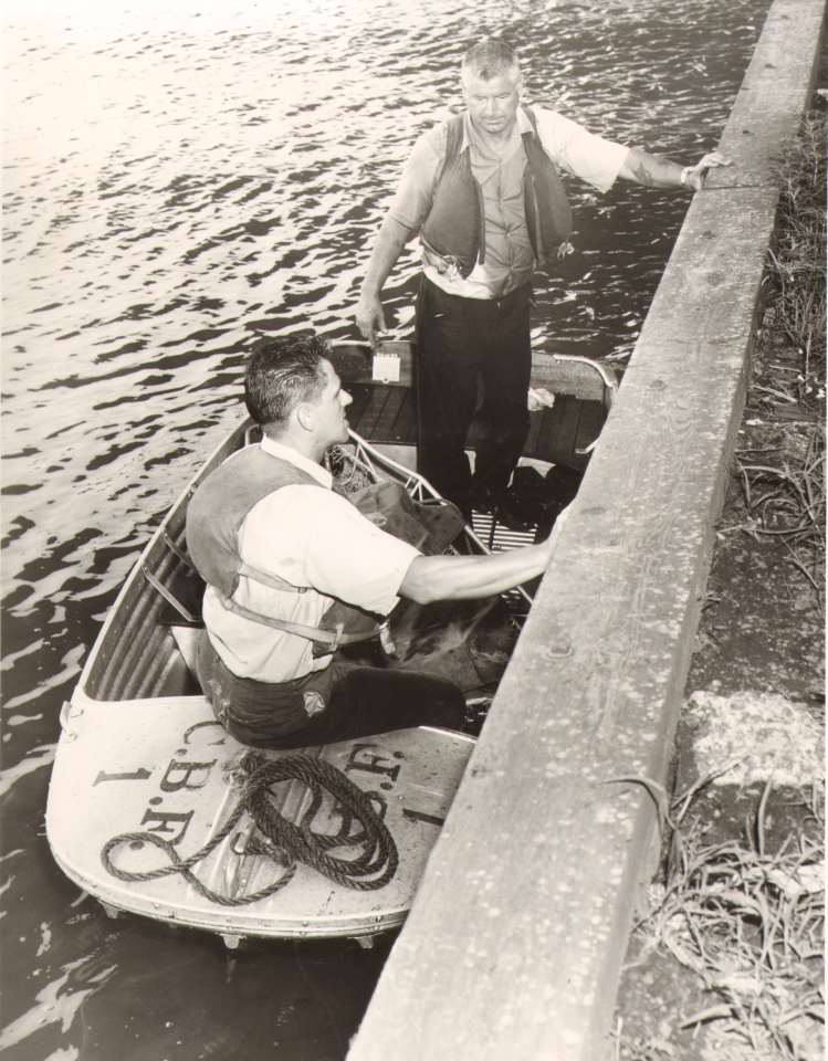 Fireman James Smith (seated) and Albert A. Weller of Rescue Company 1 during a body recovery along the Delaware River bulkhead, July 31, 1961