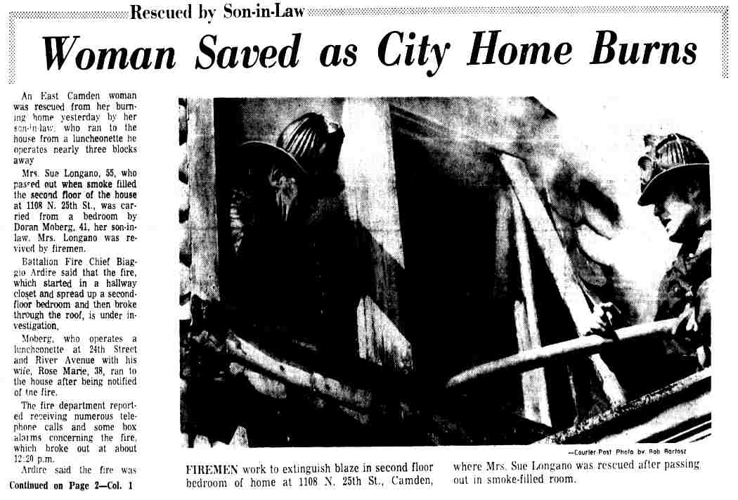 Firemen work to extinguish blaze in the second floor of the home at 1108 North 25th Street, Camden, where Mrs. Sue Longano was rescued after passing out in a smoke-filled room