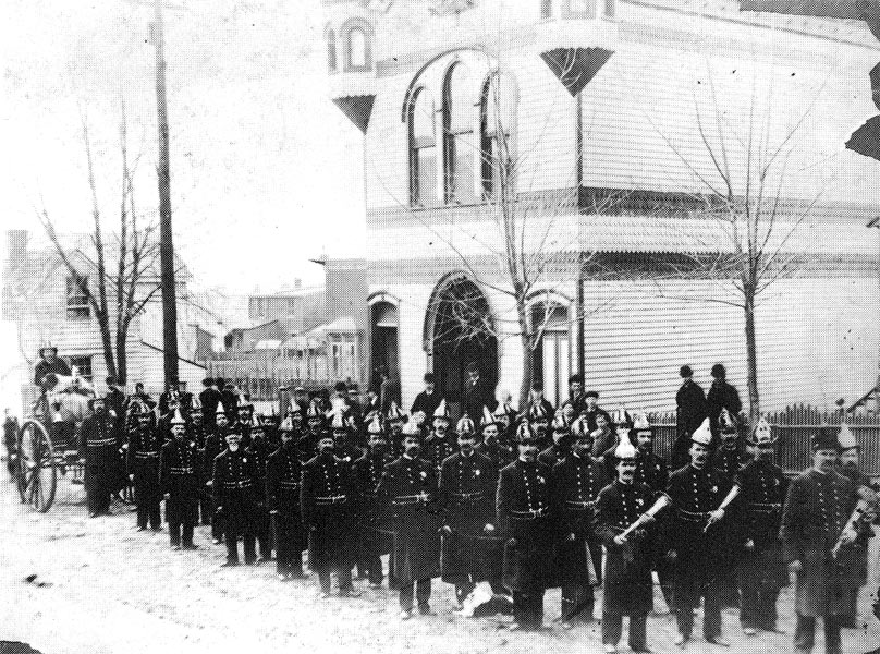 Members of Citizens Fire Company No. 1 with hose carriage in front of their new firehouse, mid-1890s