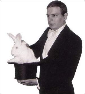 Dennis Michael at age 24 pulling a rabbit out of the hat, 1970
