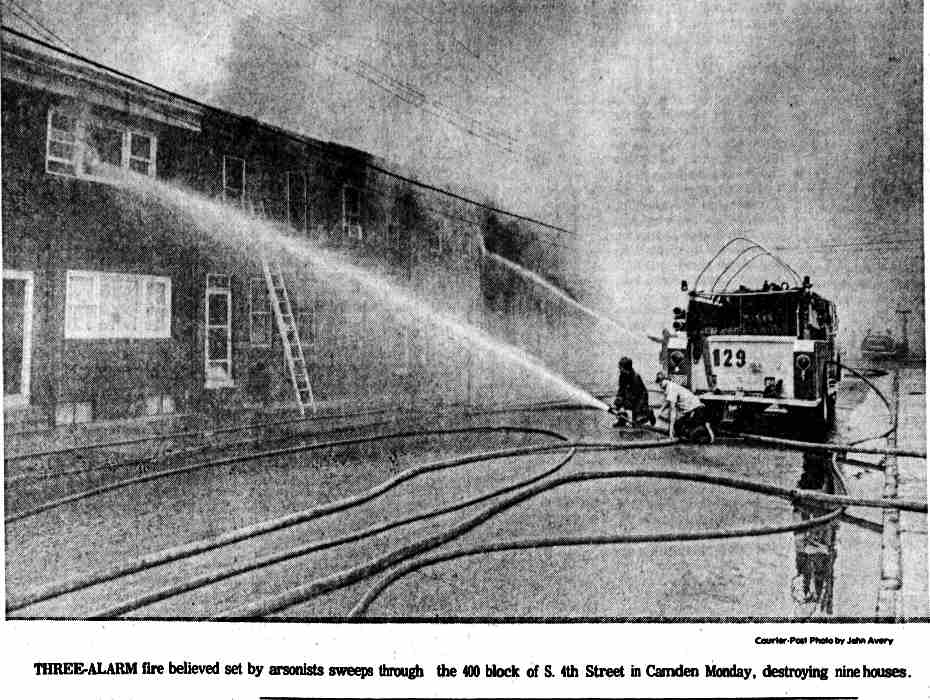 Three-alarm fire believed set by arsonists sweeps through the 400 block of S. 4th Street in Camden Monday, destroying nine houses