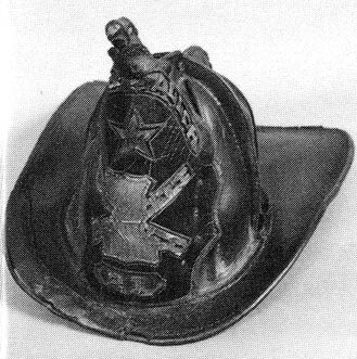 Leather helmet believed worn by Fireman Charles Baldwin, Hook & Ladder Company 1, 1869