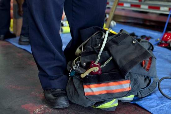 Camden Fire Department Capt. Frank Sandrock stands next to a bailout kit bag