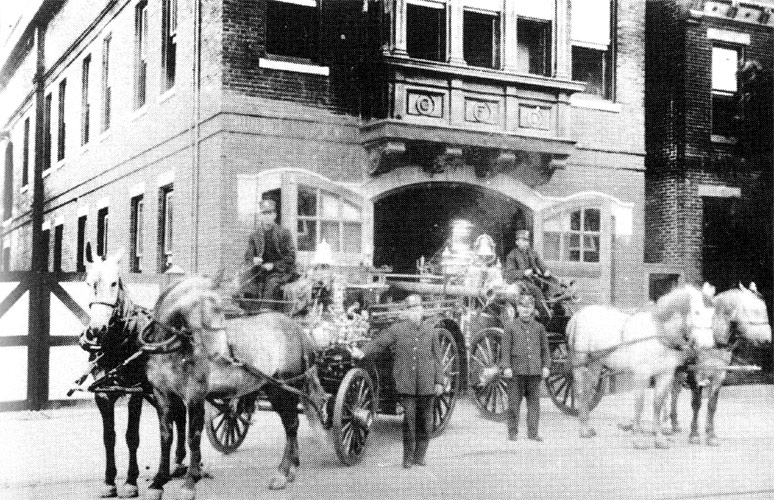 Engine Company 7 posed in front of 1115 Kaighn Avenue firehouse with horse-drawn apparatus, circa 1911