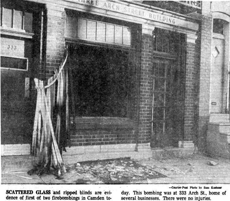 Scattered glass and ripped blinds at 333 Arch Street, Camden, site of first firebombing