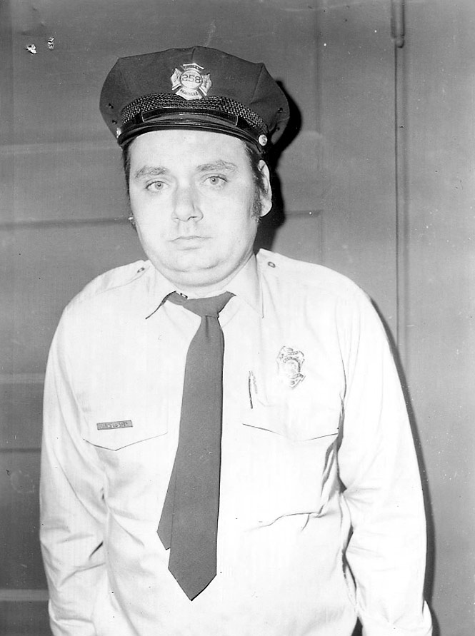Portrait photograph of James F. Gallagher in Camden Fire Department uniform, badge 258