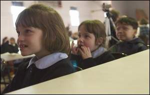 First-grade students watch The Abracadabra Magic Show by Dennis Michael