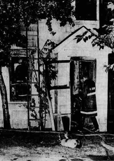 Fireman enters home at 917 North 30th Street, Camden, August 16, 1968