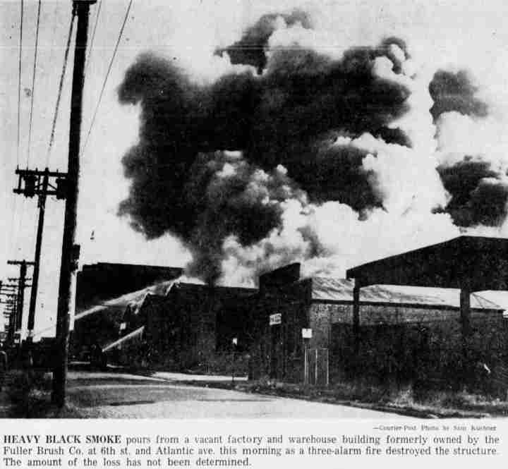 Heavy black smoke pours from the Fuller Brush building at 6th Street and Atlantic Avenue