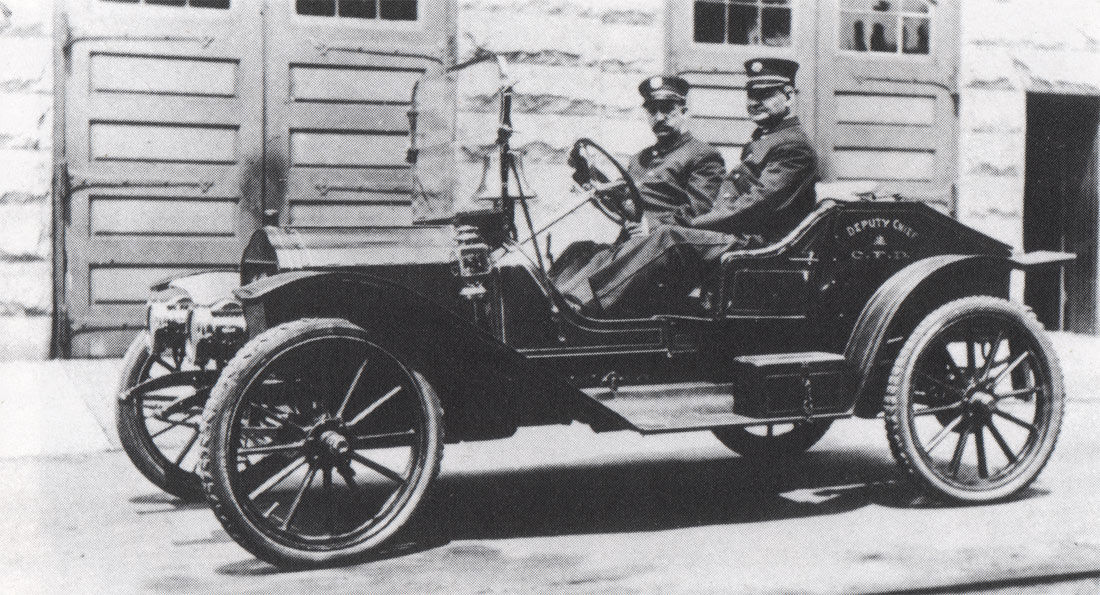Deputy Chief Peter B. Carter and his Aide, Fireman Harry V. Hankins, outside Fire Headquarters, about 1914