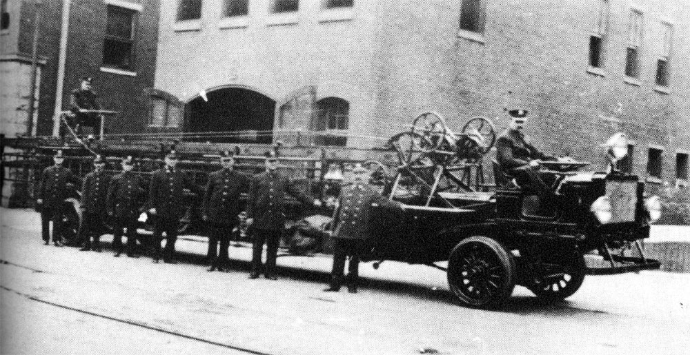 Hook & Ladder Company No. 1 with new 1914 American LaFrance 75' aerial ladder, in front of Fire Headquarters
