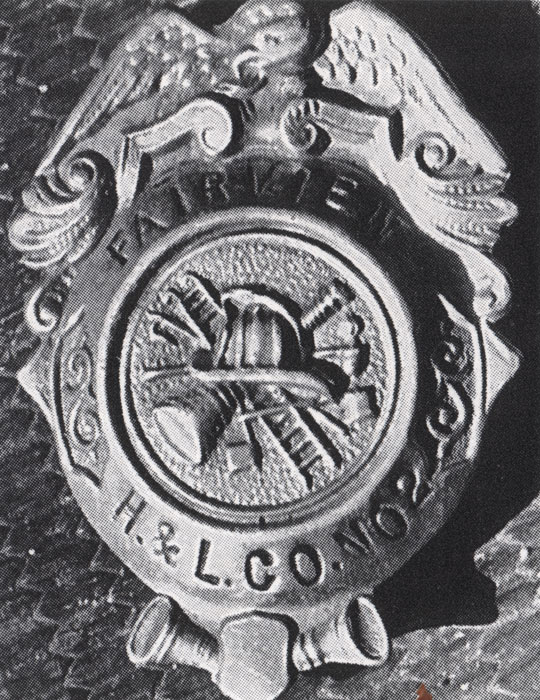 Fairview Hook and Ladder Company No. 2 badge belonging to Howard Walker