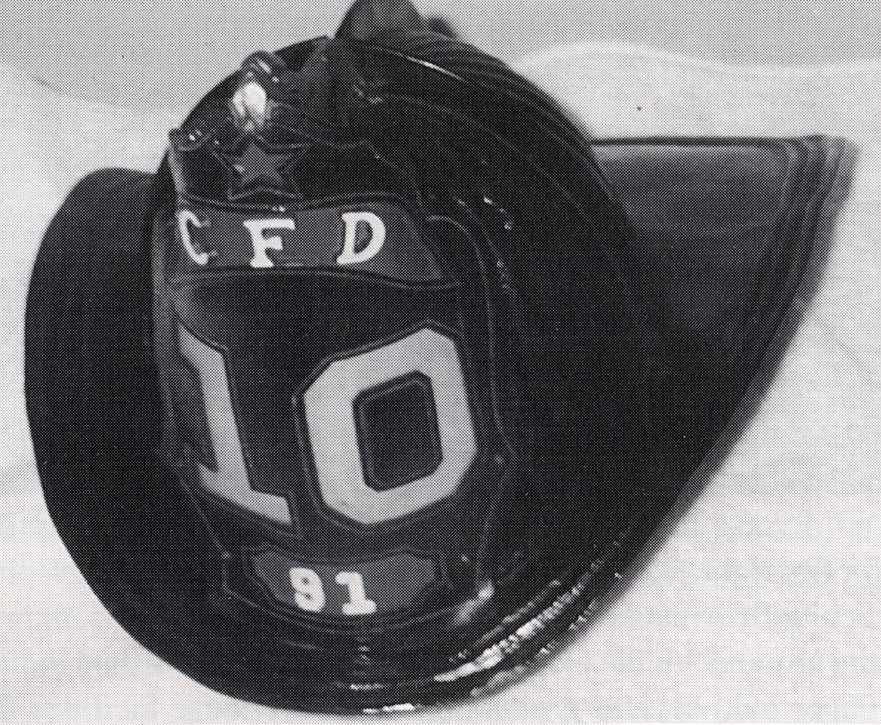 High front aluminum helmet worn by Fireman Howard Walker, Badge 91, Engine Company 10